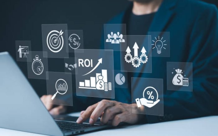 Analyzing ROI and Business Strategy Concepts. Businessman working on a laptop with various digital icons representing ROI, financial strategies, return on investment, and efficiency. marketing plan,